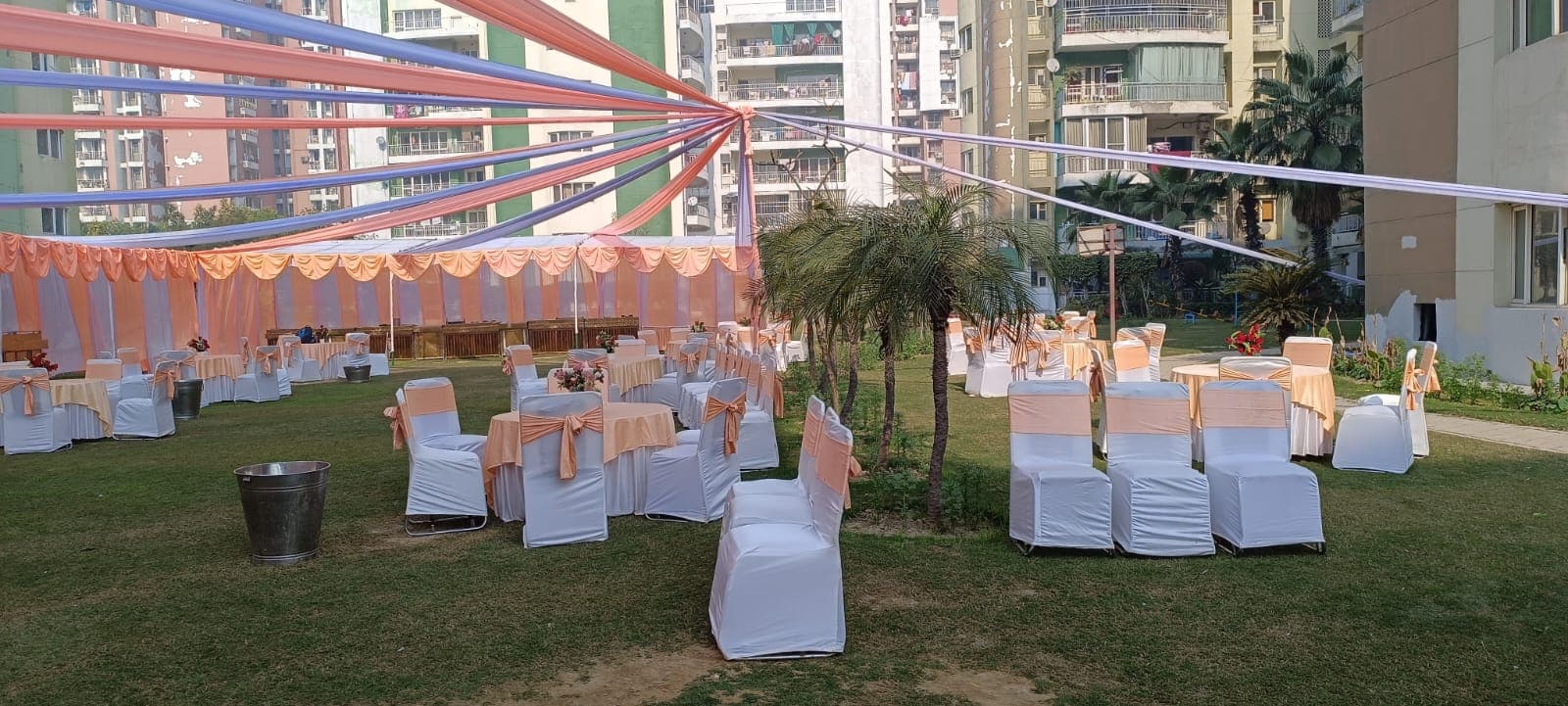 Grand illuminated nighttime wedding tent setup with cascading warm fairy lights and royal floral gateway by Shri Raghav Ji Tent House